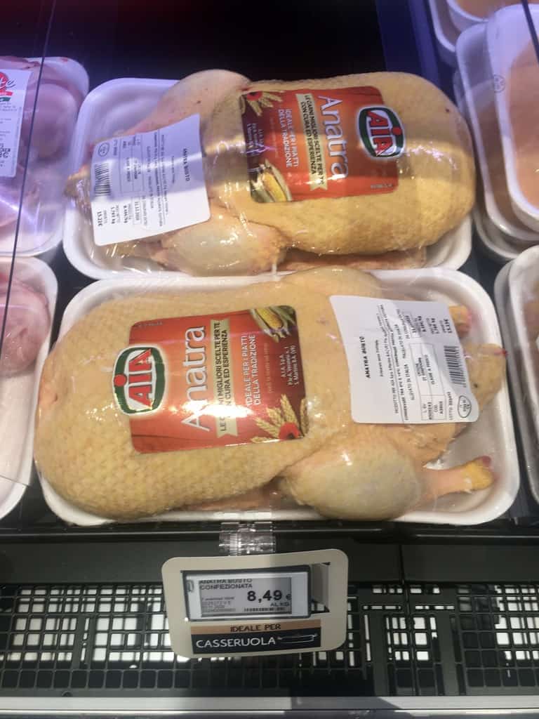 whole ducks in the cooler case at a local Italian supermarket