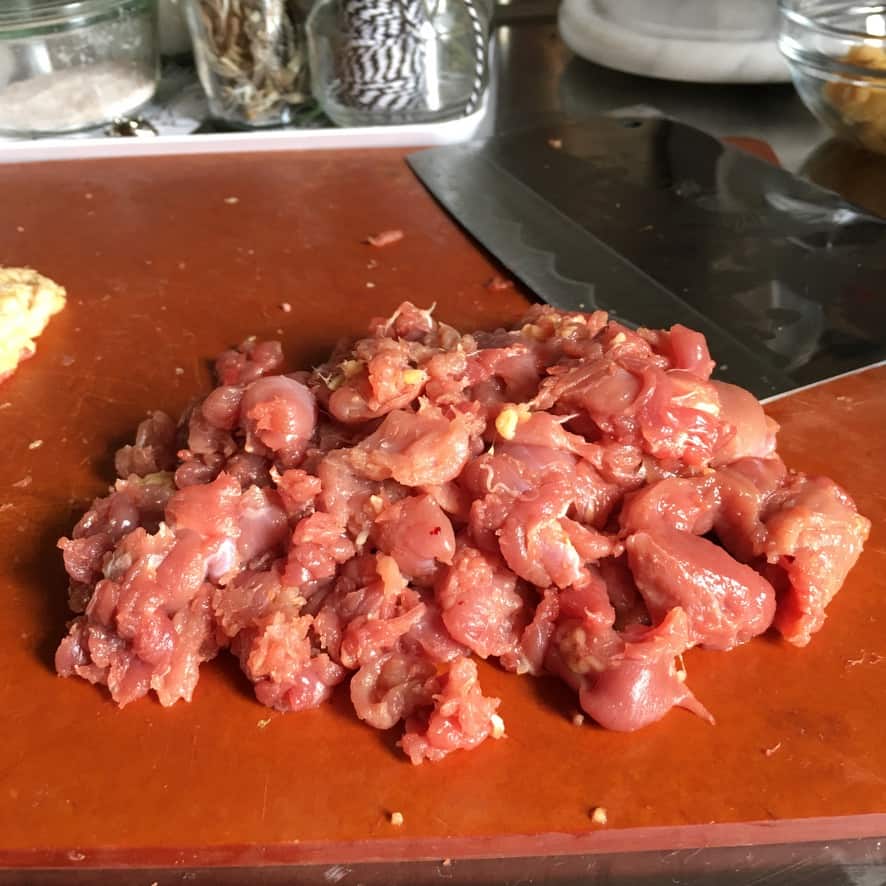 pile of raw duck meat from deboning