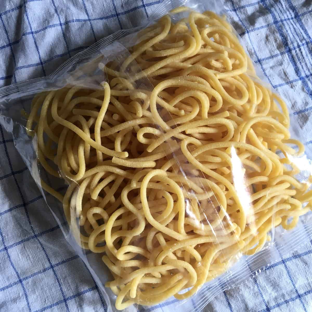 Bigoli pasta package from Italian grocery store back side of bag showing the full pasta contained within used for traditional venetian duck ragu.