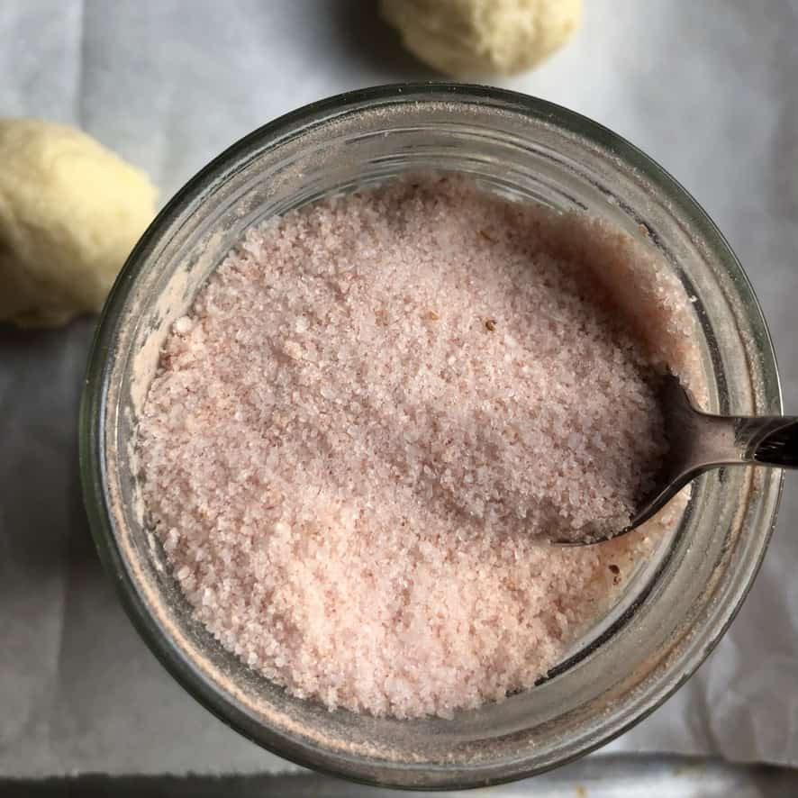 view down into the strawberry sugar jar with rolled dough balls in view