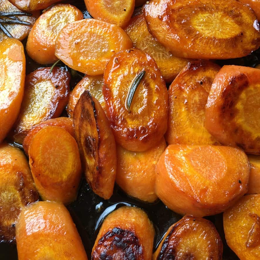 perfectly pan seared carrot rounds glistening with olive oil