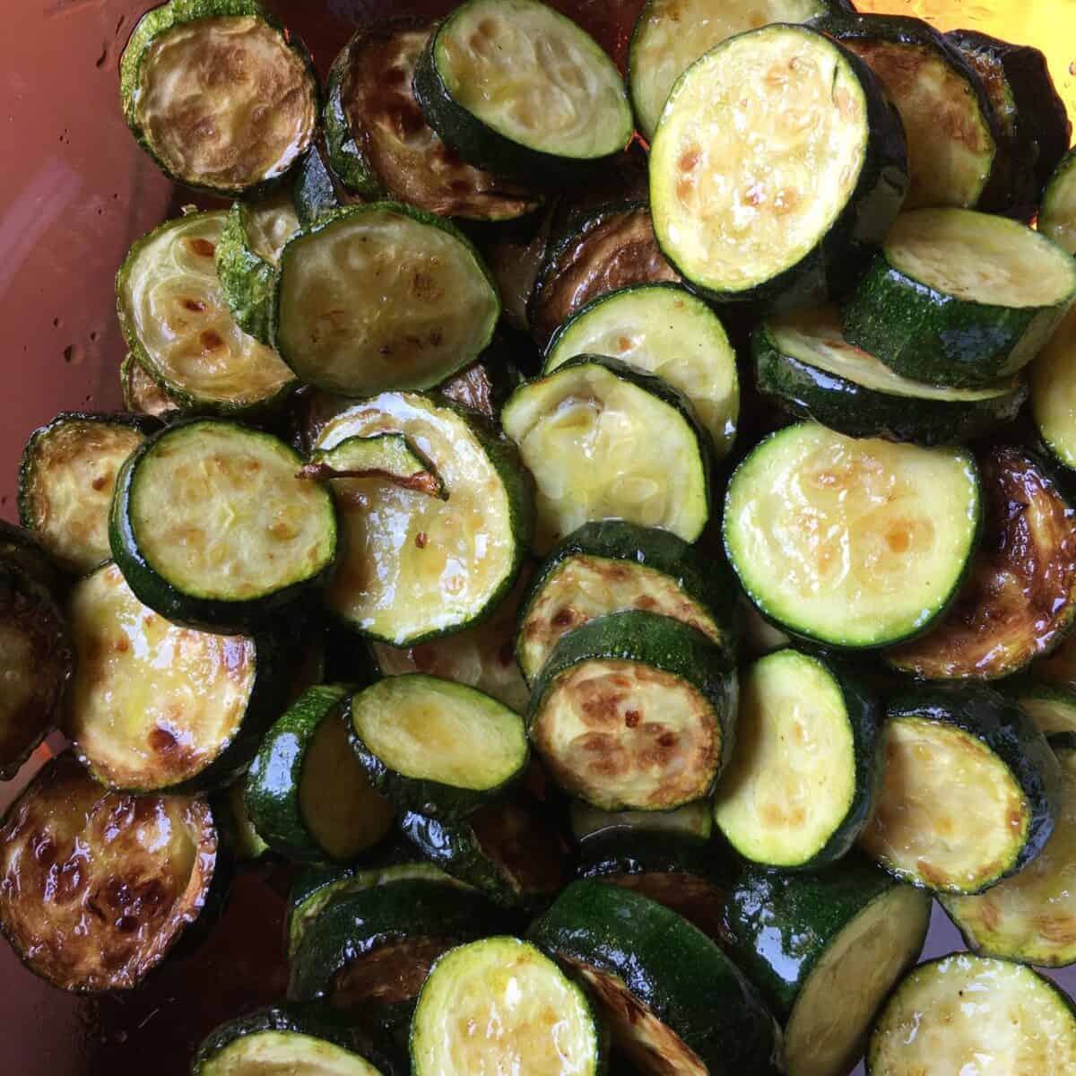 closeup pan-seared caramelized and golden brown zucchini rounds