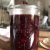 small Weck Jar with beautifully dark berry sauce in it