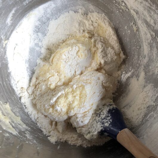folding flour mixture into cookie dough