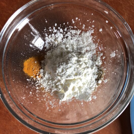 cornstarch, turmeric, salt and white pepper in a small glass prep bowl