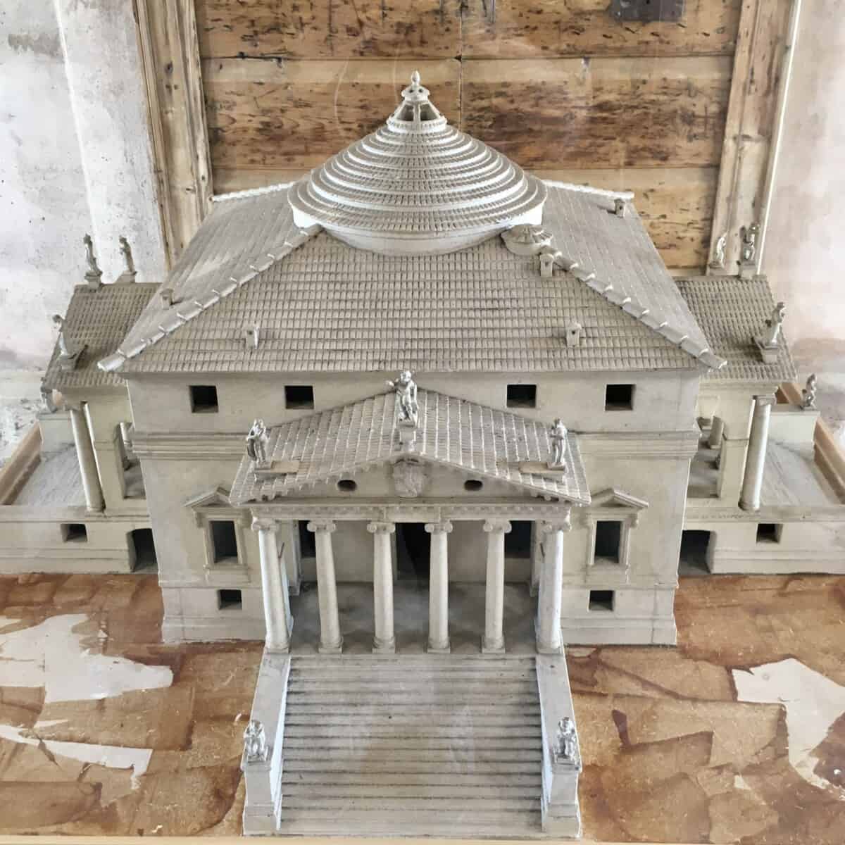 a 3D model of Andrea Palladio's Villa La Rotonda on the premises in a glass case