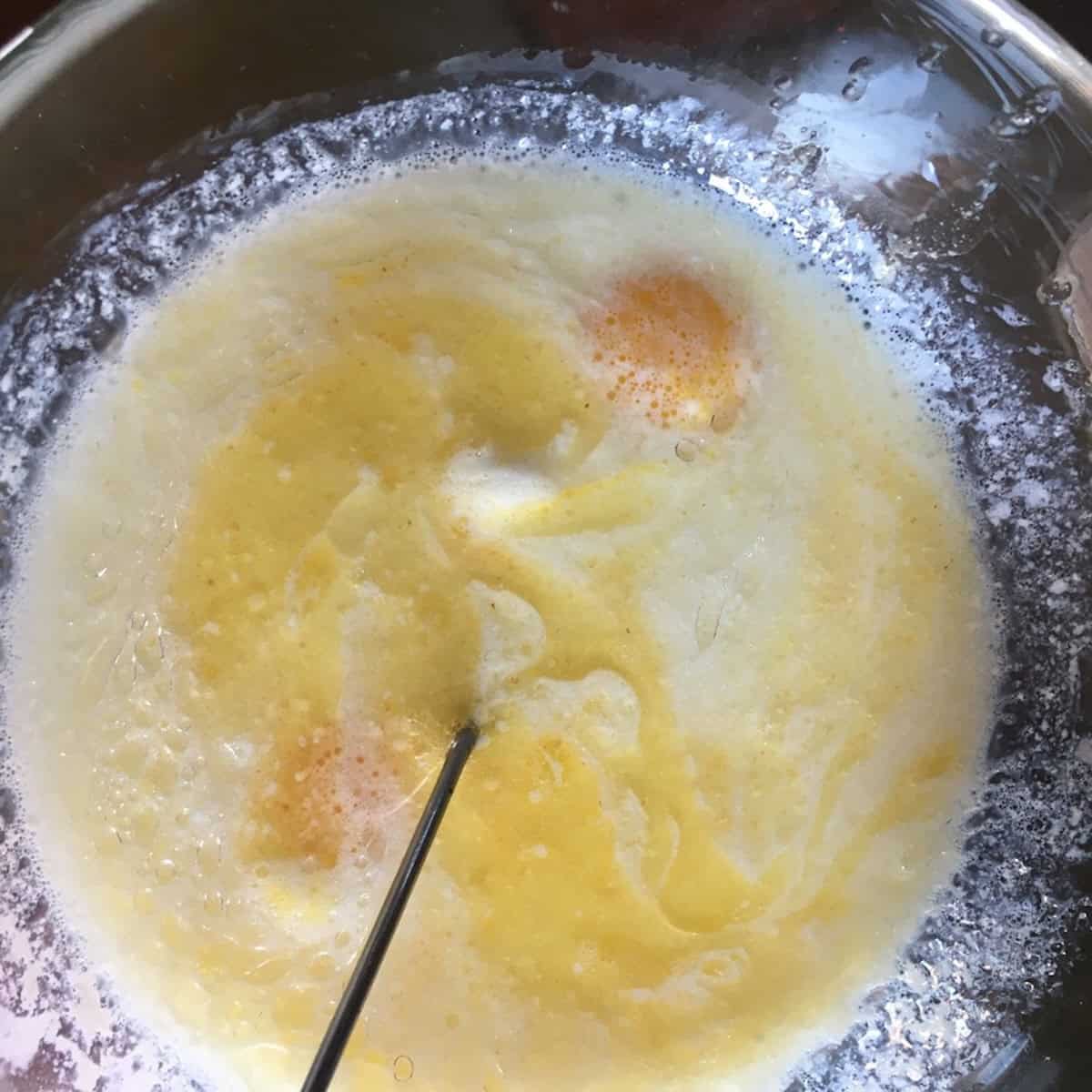 All wet ingredients needing to be whisked together in a bowl for small batch pancakes.