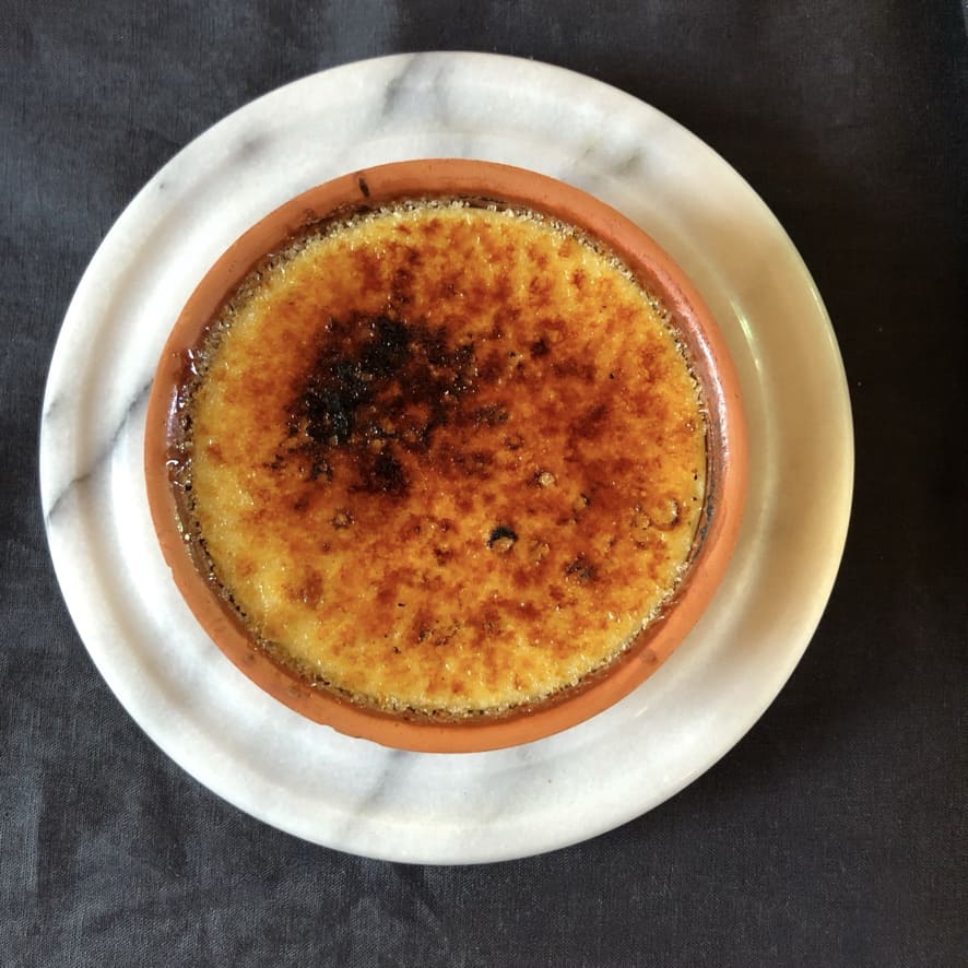 a torched brûléed white chocolate cheesecake