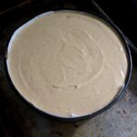 the remaining pumpkin cheesecake base added to the springform pan and smoothed out ready to be baked