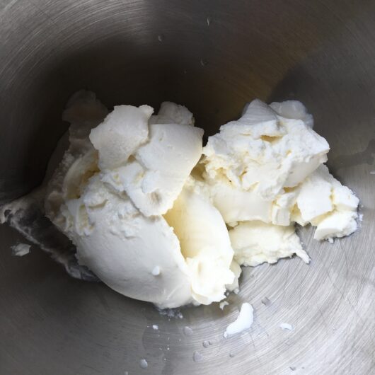 cream cheese and mascarpone in the bowl of a stand mixer