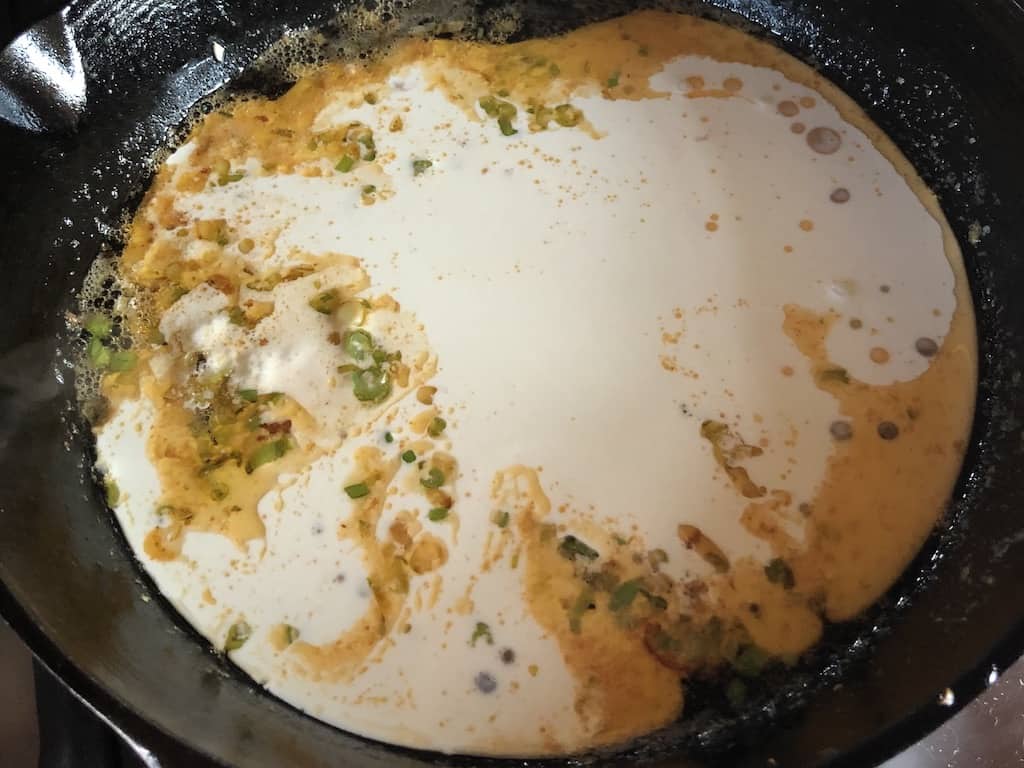 cream added to the skillet with butter, scallion and the fond from the pan-seared shrimpsautéed