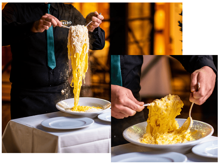 an image of the Mantecatura tossing the original Roman Fettuccine Alfredo dish table side at Aflredo Alla Scrofa restaurant