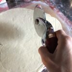 using a pizza wheel cutter to make the heart shape