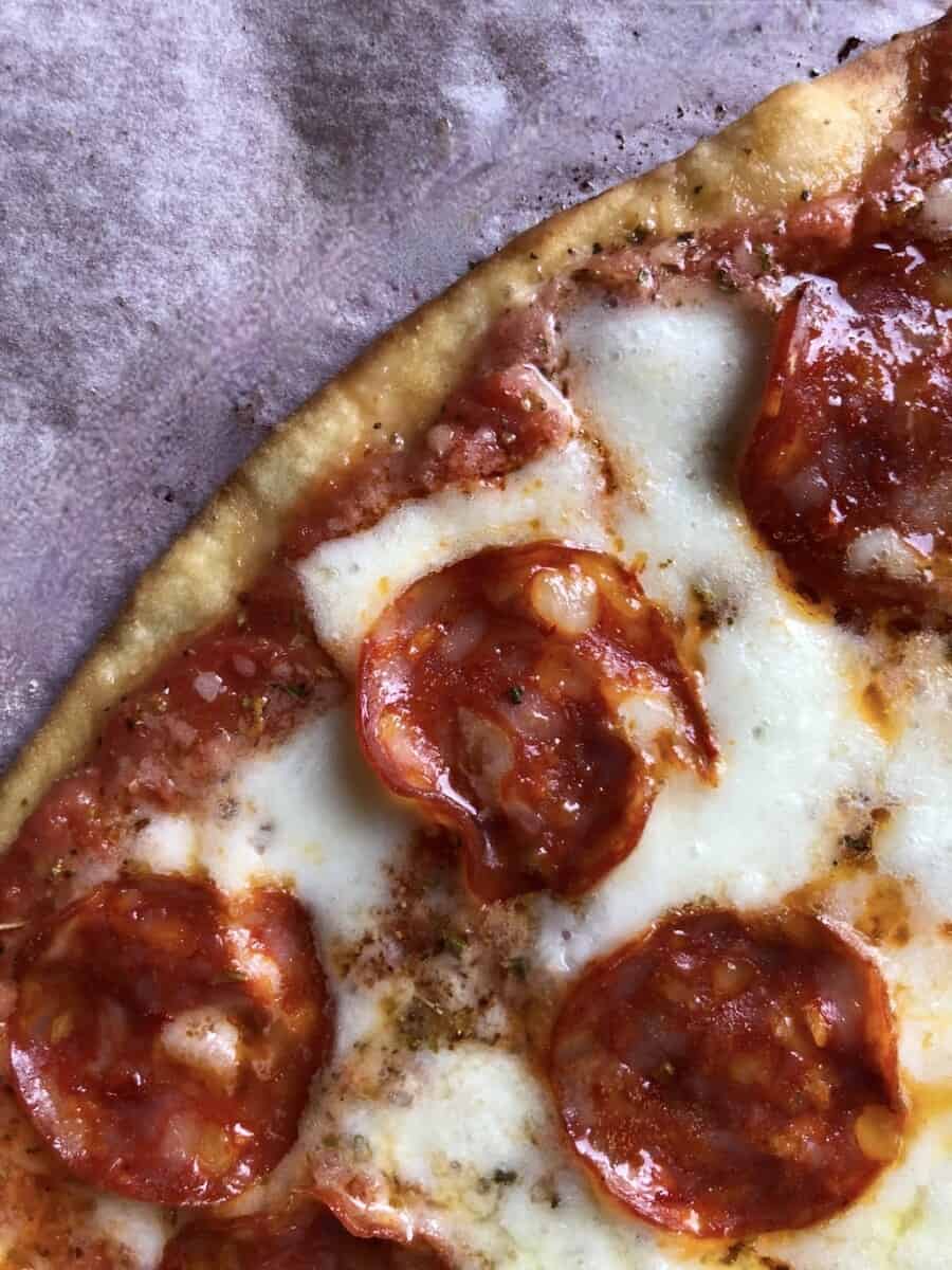 closeup of a buffalo mozzarella and pepperoni pizza ooey gooey after being baked