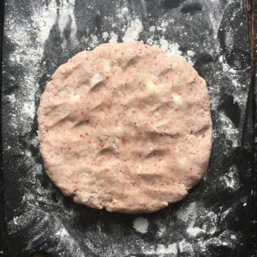 a perfect pink butter-specked disc of strawberry scone dough