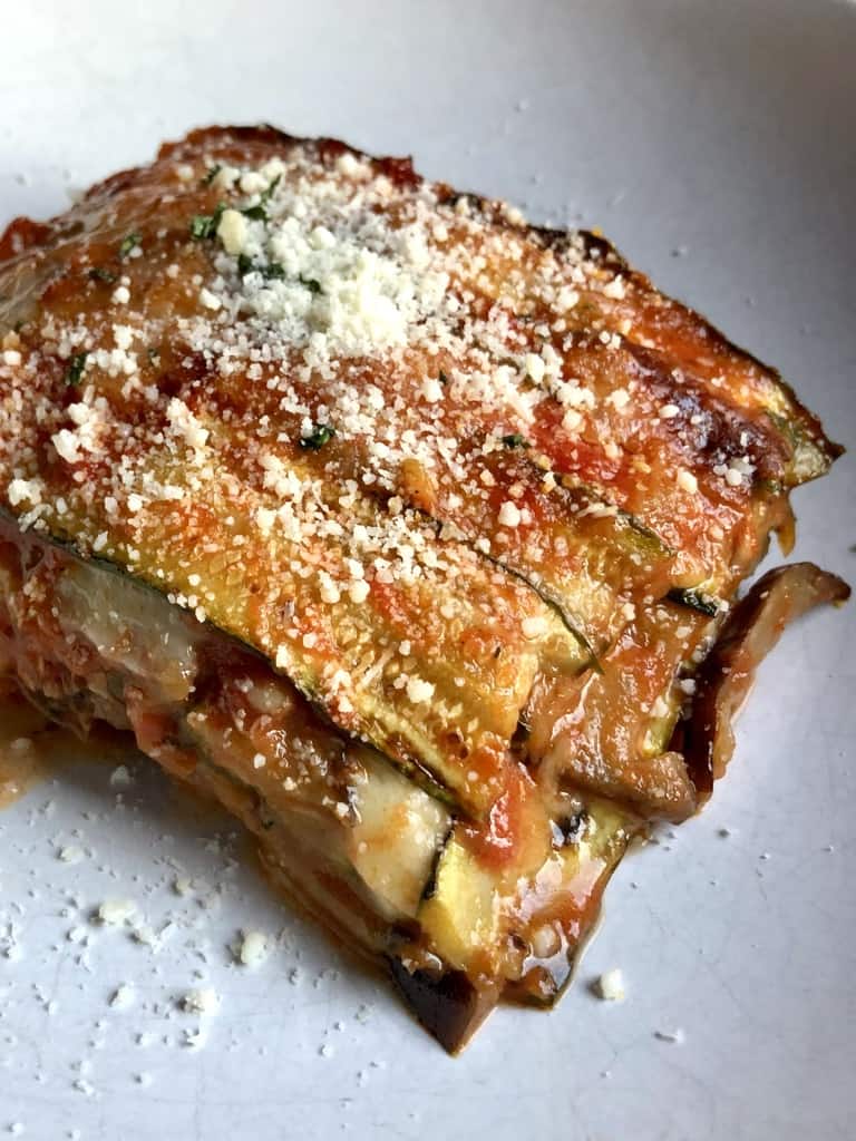 eggplant and zucchini parm with sprinkled grated cheese on top
