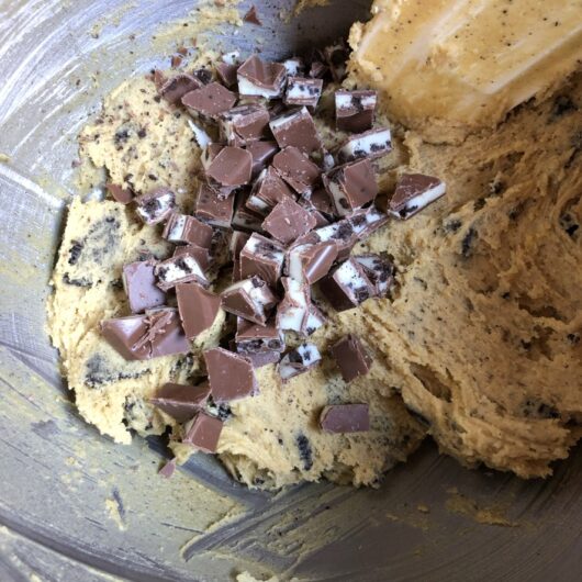 chopped milka oreo bar in the oreo chocolate chunk cookie dough