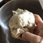 showing the texture of the dough in my hand just after it comes together and is the right consistency