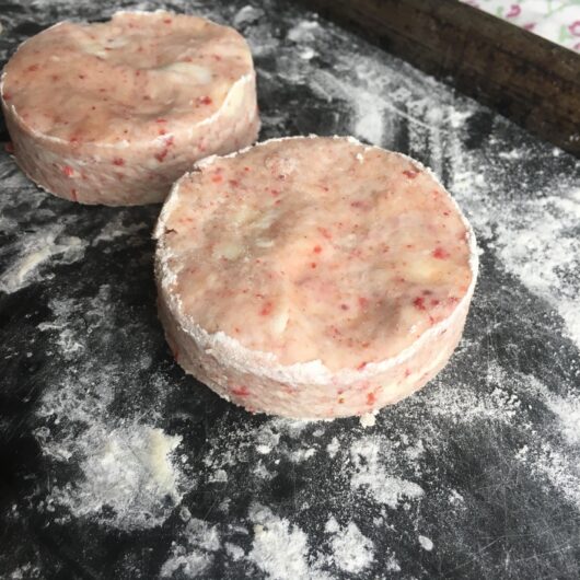pink raw strawberry scones cut out using a circular round cutter