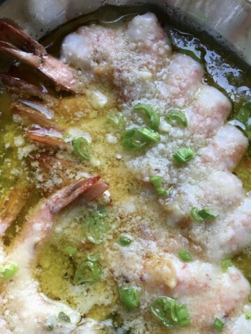 Garlic butter shrimp scampi with extra virgin olive oil, grated parmigiano reggiano parmesan and scallions, garlic shrimp scampi recipe.