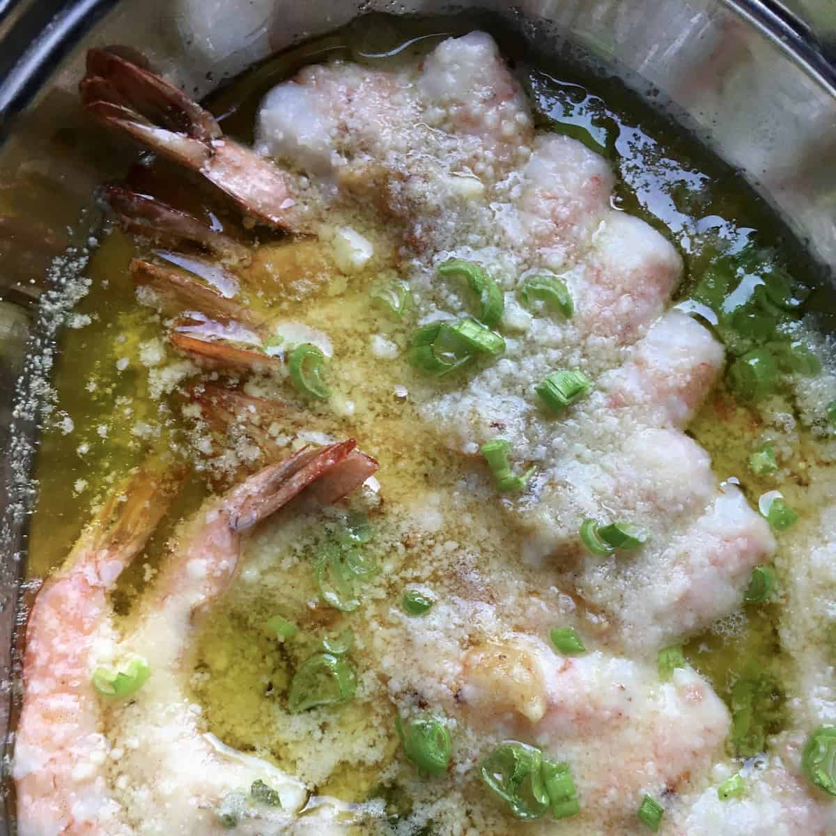 Garlic butter shrimp scampi with extra virgin olive oil, grated parmigiano reggiano parmesan and scallions, garlic shrimp scampi recipe.