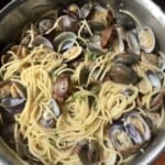 Spaghetti alle vongole with veraci clams in All-Clad saute pan, best clam pasta recipe with fresh Italian clams.