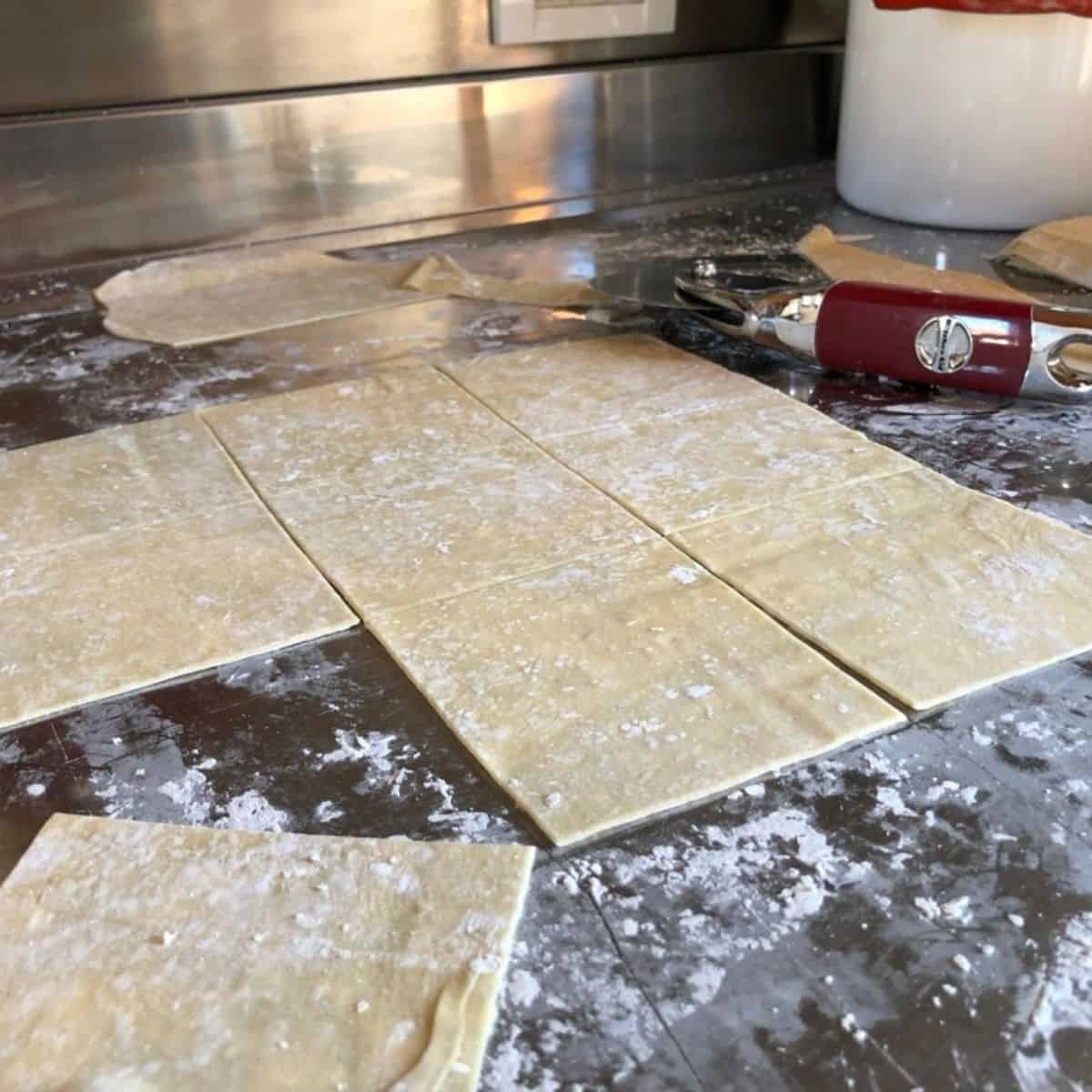 Cut square homemade wonton wrappers ready to stack or fill, wonton wrapper recipe for fresh wonton skins you can use for wontons or dumplings
.
