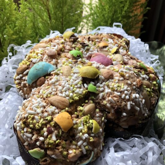 a fully baked beautiful Easter egg covered colorful Colomba