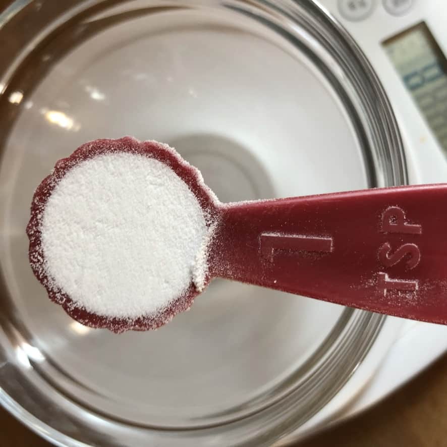 a teaspoon holding baking soda