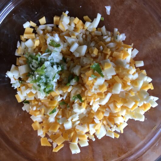 chopped scallions added to diced cheese mixture