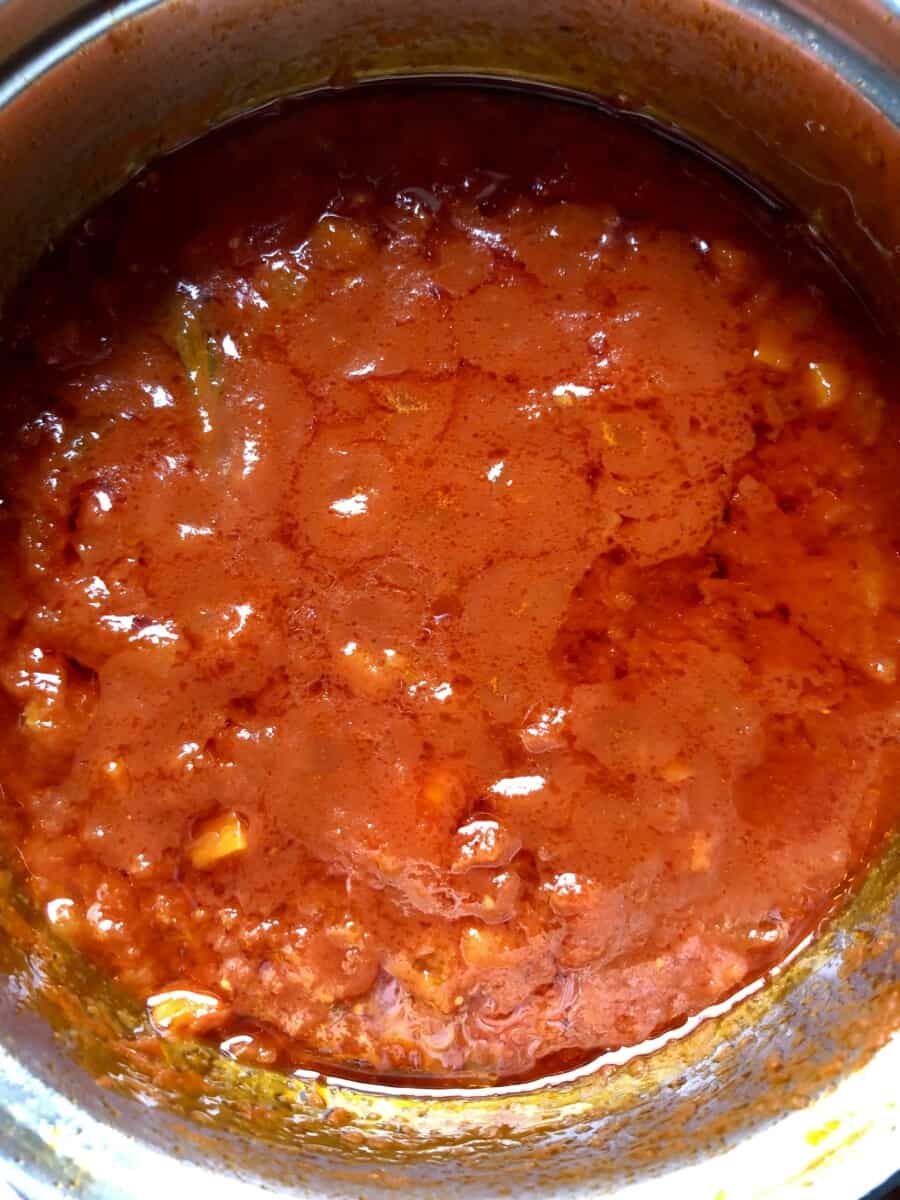 pot full of the best homemade tomato sauce recipe not yet cooked long enough