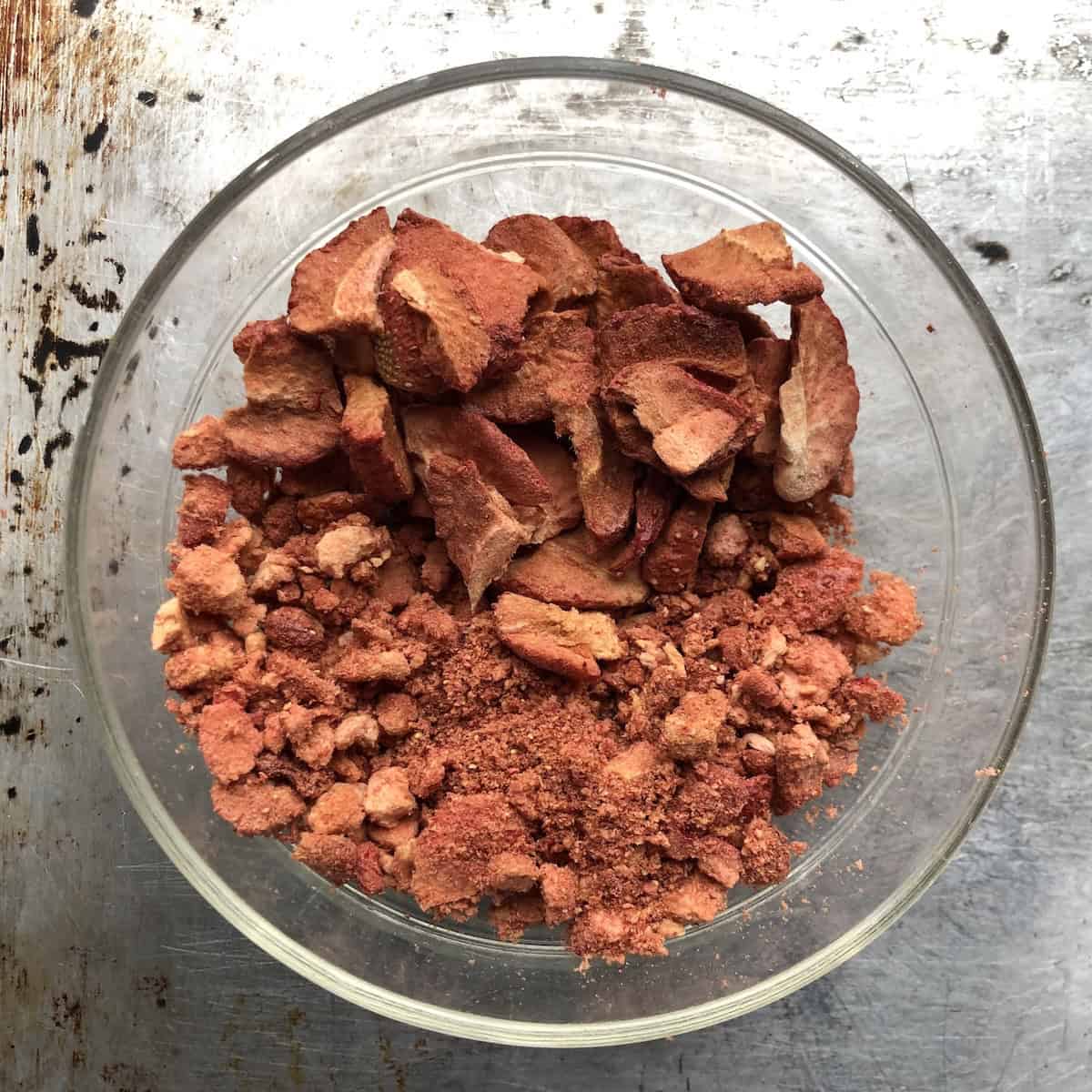 A bowl of freeze-dried strawberry pieces and powder for strawberry banana bread.
