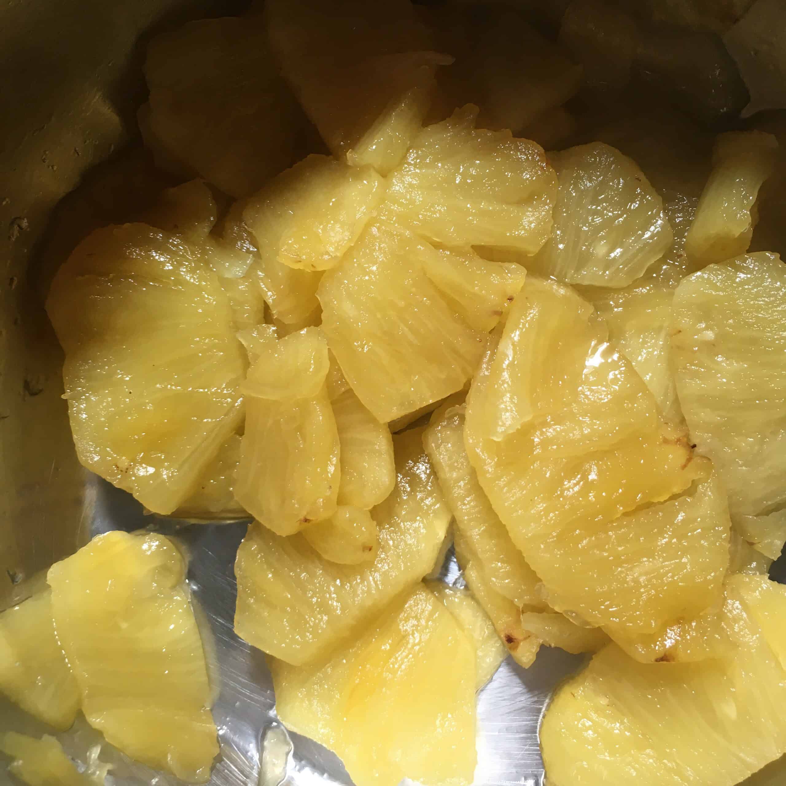 Homemade lightly sweetened cooked pineapple ready to be finely diced for baking, a fresh alternative to canned crushed pineapple for an old fashioned carrot cake recipe with pineapple or any moist carrot cake with pineapple.