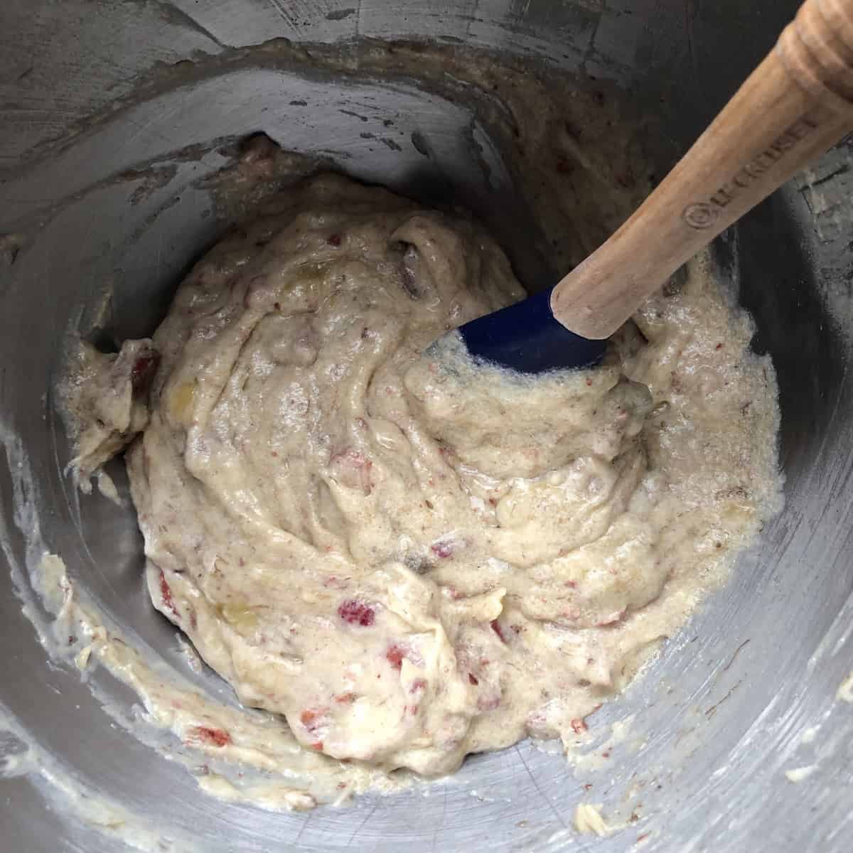 Strawberry banana bread batter with freeze-dried strawberries fully folded in.