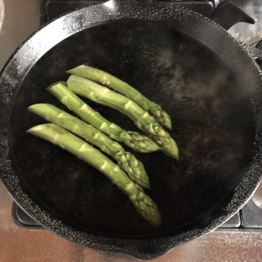 blanching asparagus spears in boiling salted water