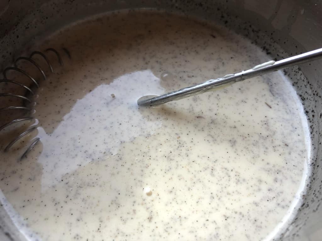 white chocolate vanilla bean panna cotta as it cooks