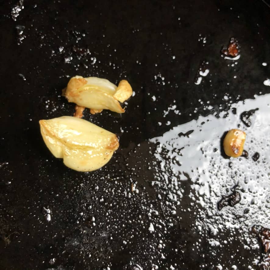 Satuteing 2 garlic cloves in extra virgin olive oil.