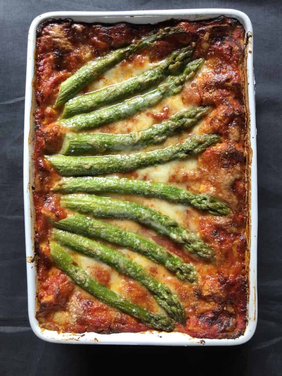 fully baked and bubbling asparagus and speck lasagna
