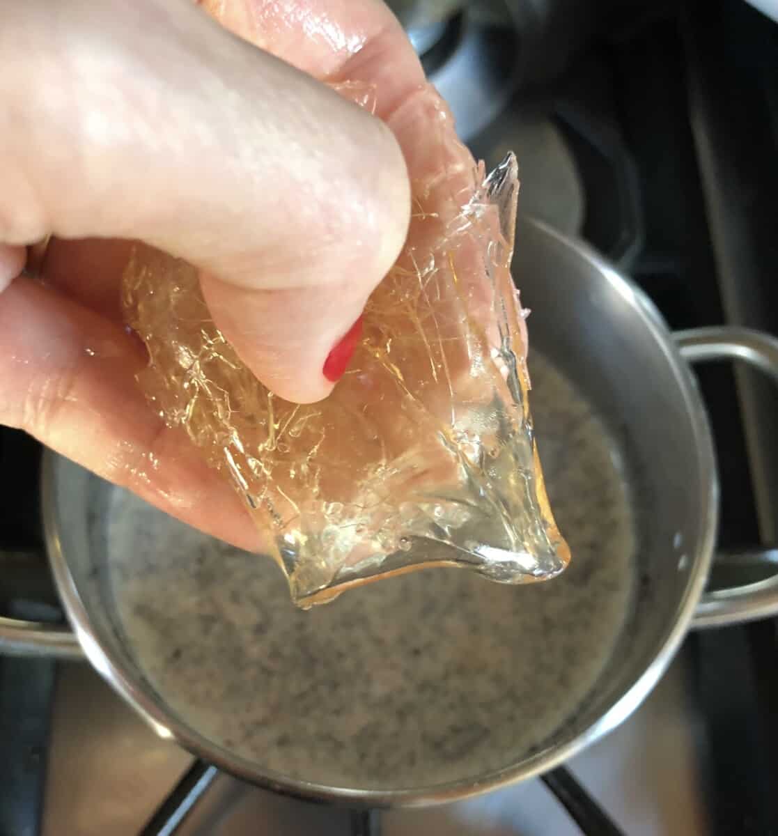 adding bloomed gelatin to the cream and sugar mixture