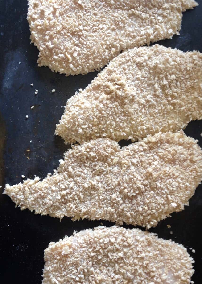 breaded chicken cutlets before being fried