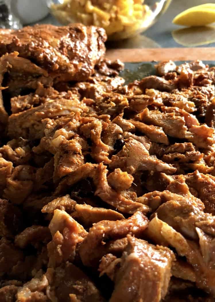 delicious sliced tacos al Pastor meat on a cutting board
