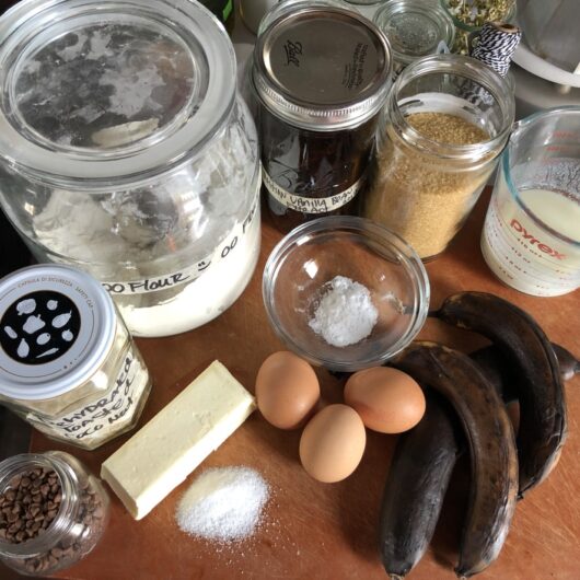 chocolate chip banana bread cake ingredients on a cutting board on the countertop