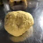 placing the pasta dough onto a surface to knead it