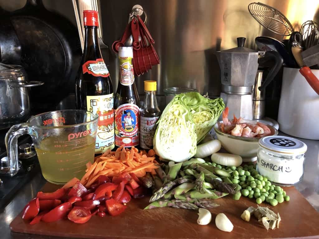 Shrimp and Vegetable stir fry ingredients on a cutting board