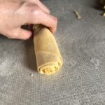rolled up sheet of fresh pasta to be cut into wide ribbons of papperdelle