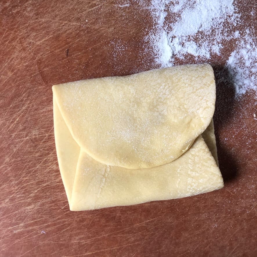 a piece of pasta dough folded like a letter