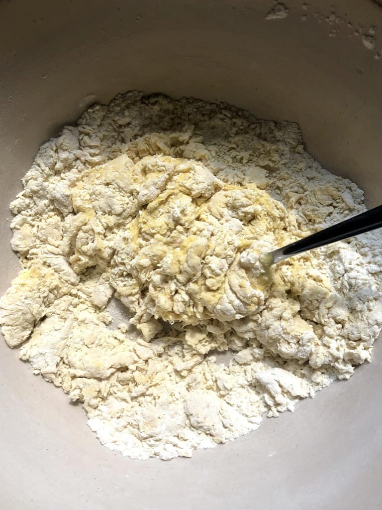 flour with eggs just incorporated and no ball of dough formed yet