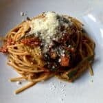 summer fresh tomato and zucchini pasta sprinkled with Grana Padano cheese