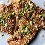 beautifully cooked soy ginger miso salmon sprinkled with toasted sesame seeds and sliced scallions