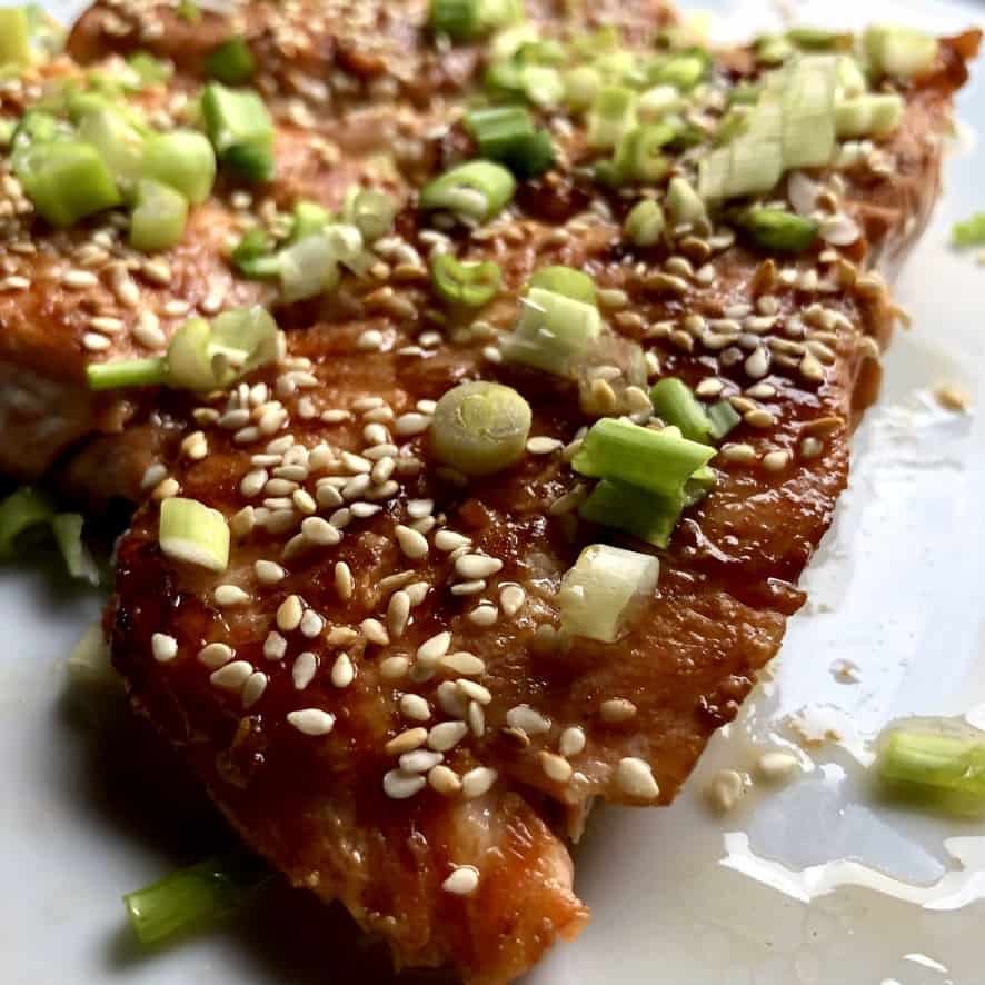 cooked soy ginger miso salmon sprinkled with toasted sesame seeds and sliced scallions